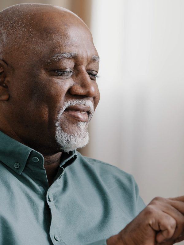 Close up bald American bearded old senior man with gray beard elderly male using software application net on cellphone reading message email swiping browsing online app. smartphone Wi-Fi technology. High quality photo
